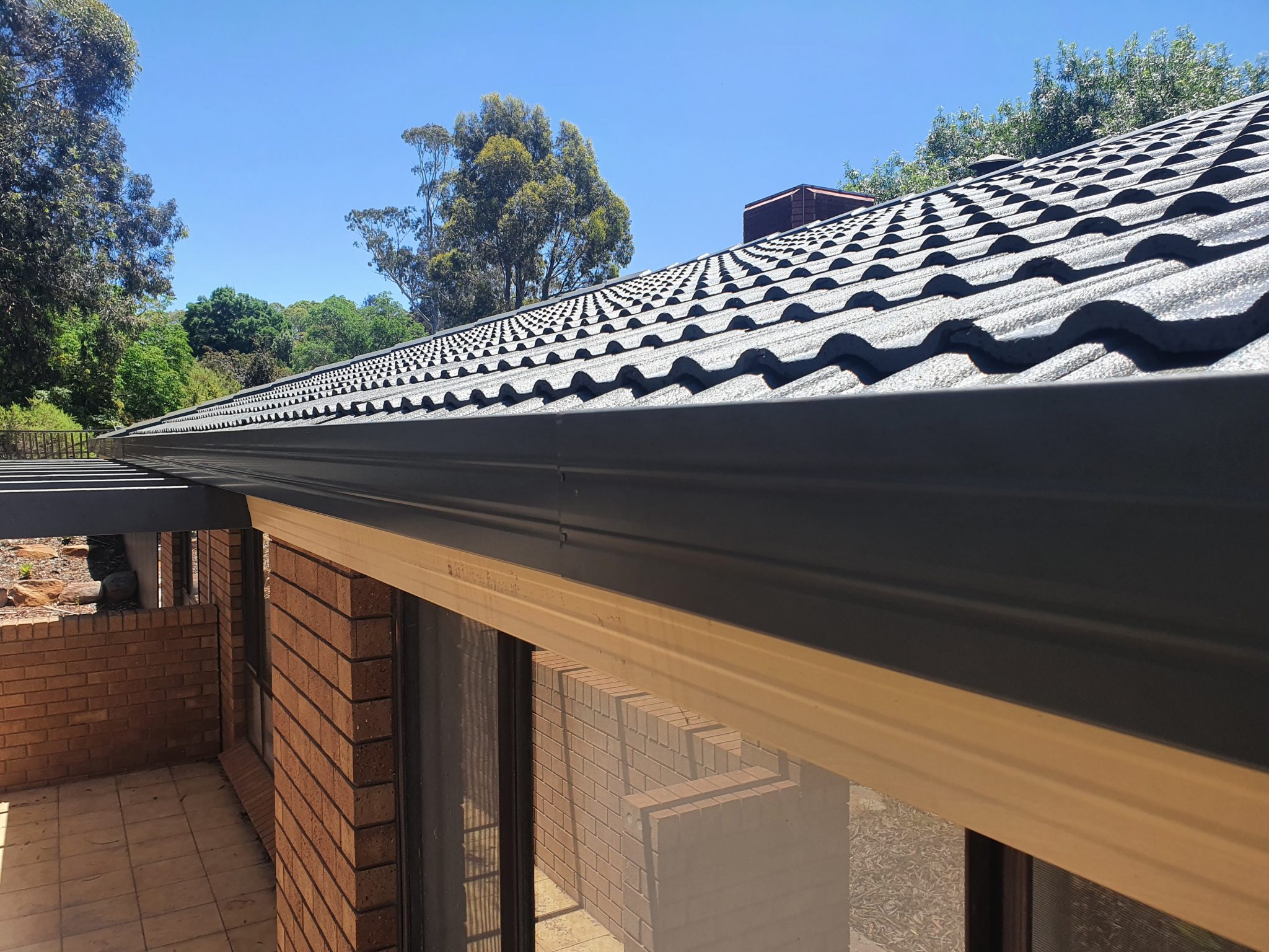 Gutter running along a tiled roof